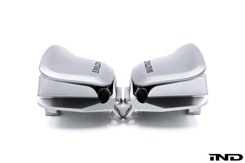 JQ Werks MadTrace C8 Corvette magnetic shift paddles installed inside a car, featuring sleek white design and ergonomic buttons.