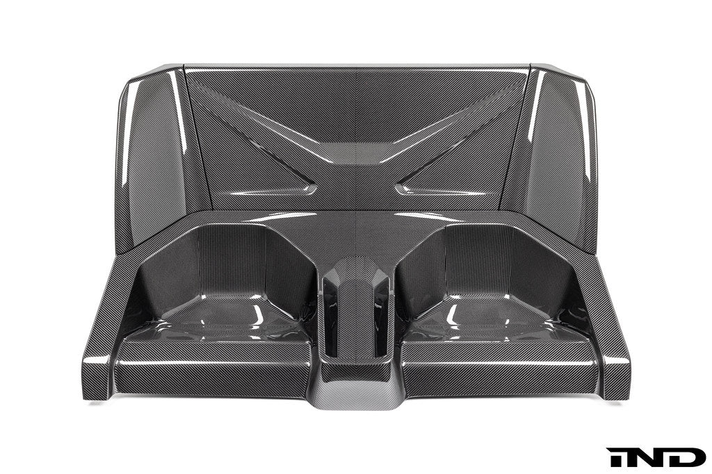 Karbonius carbon fiber rear seat delete closeout kit for BMW G87 M2 on a white background