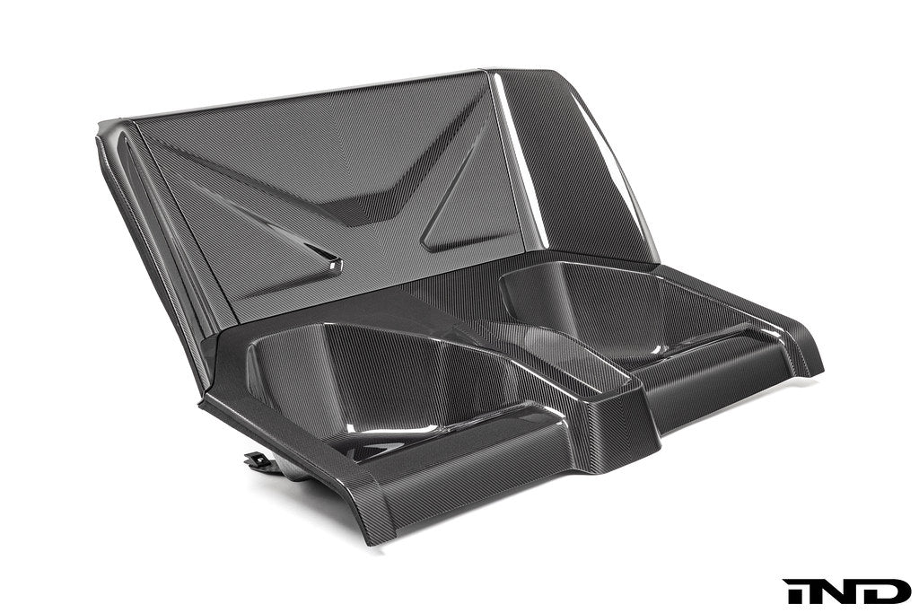 Karbonius carbon fiber rear seat delete closeout kit for BMW G87 M2 on a white background