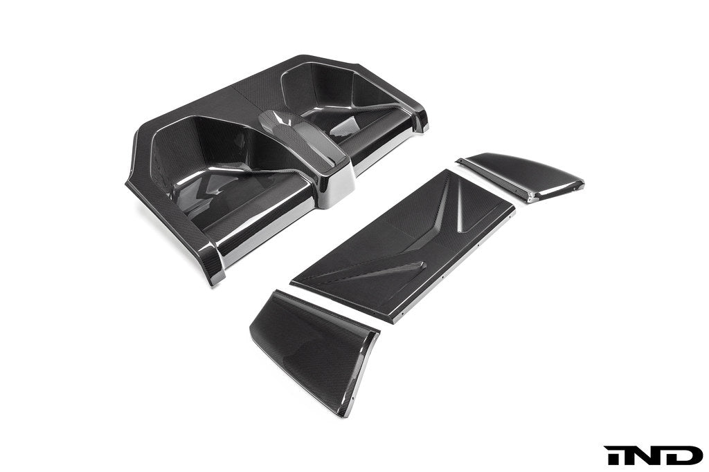 Karbonius carbon fiber rear seat delete closeout kit for BMW G87 M2 on a white background