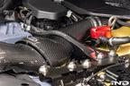 Karbonius gloss carbon fiber strut brace set for BMW G90 M5 and G99 M5 installed in engine bay
