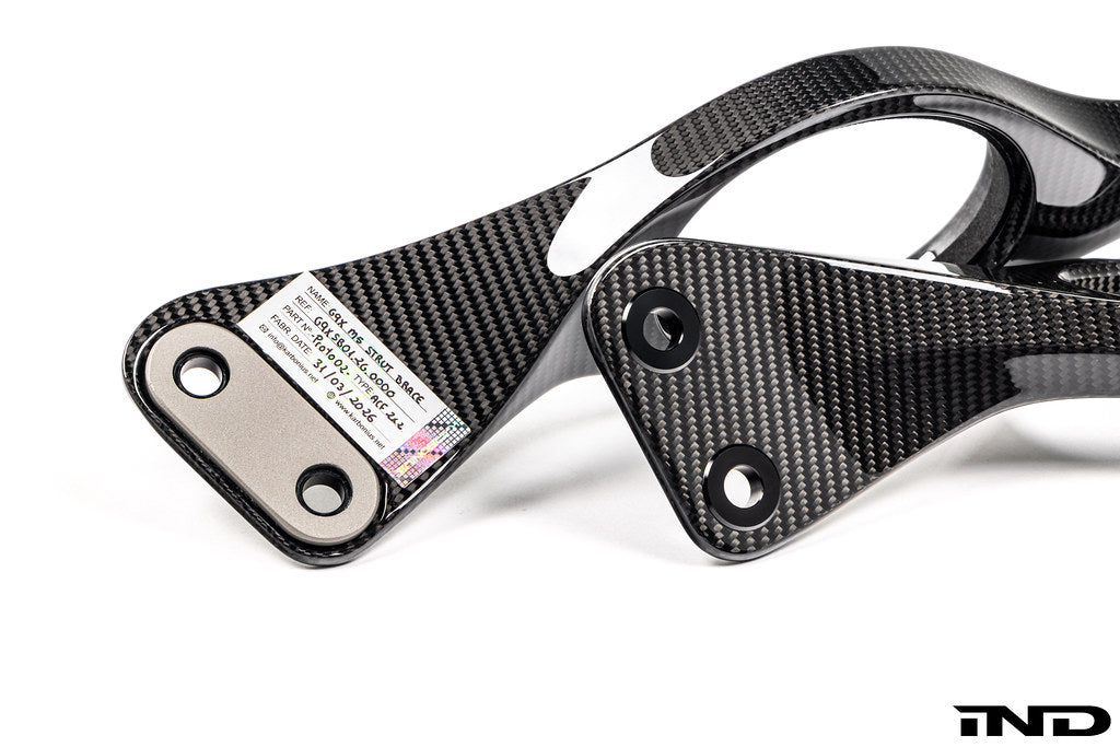 Karbonius carbon fiber strut brace set for BMW G90 M5 and G99 M5 in gloss finish on white background