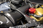 Karbonius gloss carbon fiber strut brace set for BMW G90 M5 and G99 M5 installed in engine bay