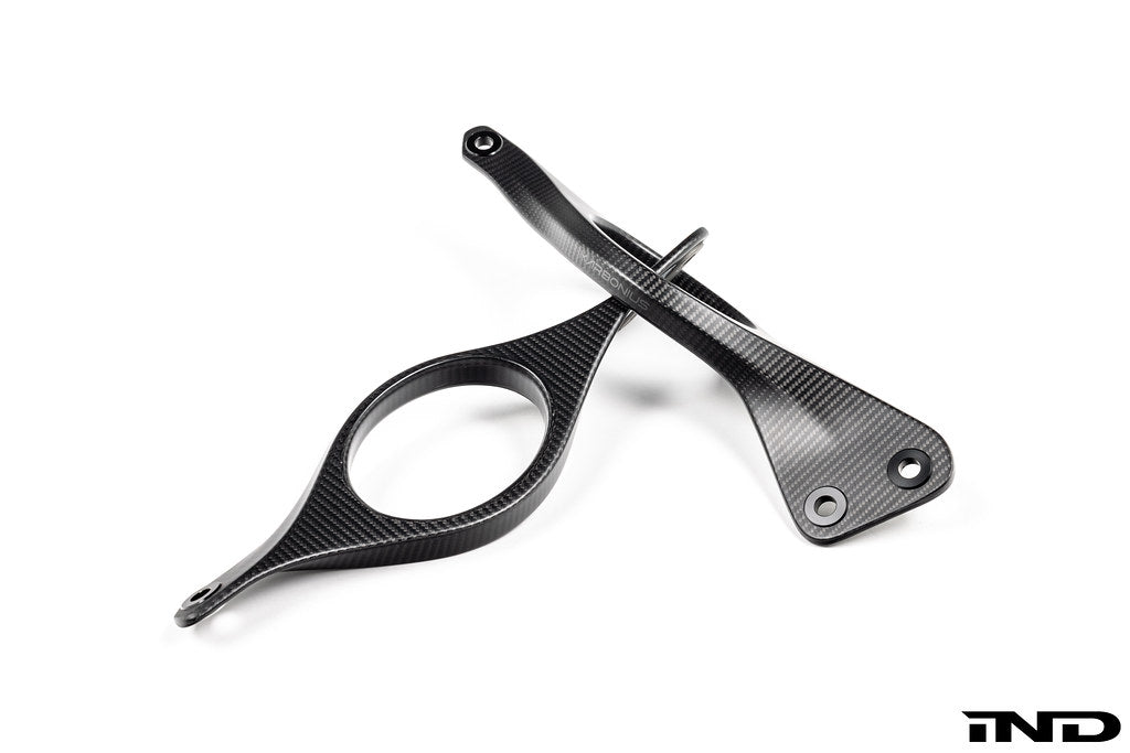 Karbonius G90 G99 M5 carbon fiber suspension strut brace set on a white background, enhancing vehicle stability and performance.