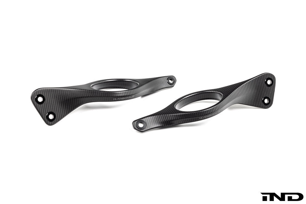 Karbonius G90 G99 M5 carbon fiber strut brace set for suspension with white background, showcasing lightweight, high-performance automotive parts