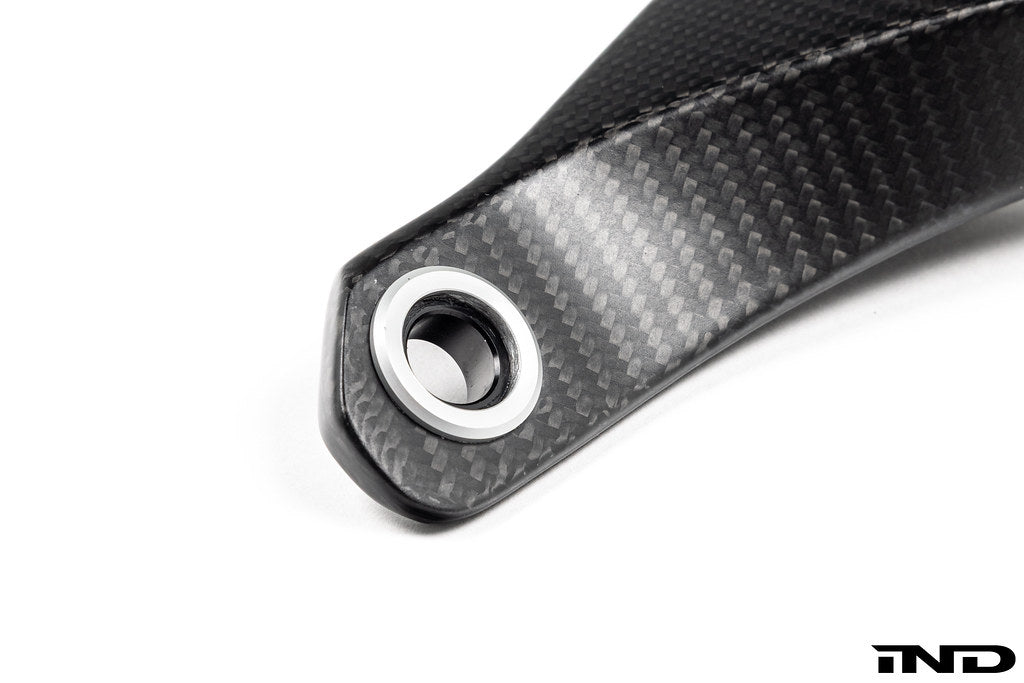 Karbonius G90 G99 M5 carbon fiber suspension strut brace set on white background, showcasing lightweight, high-performance automotive parts.