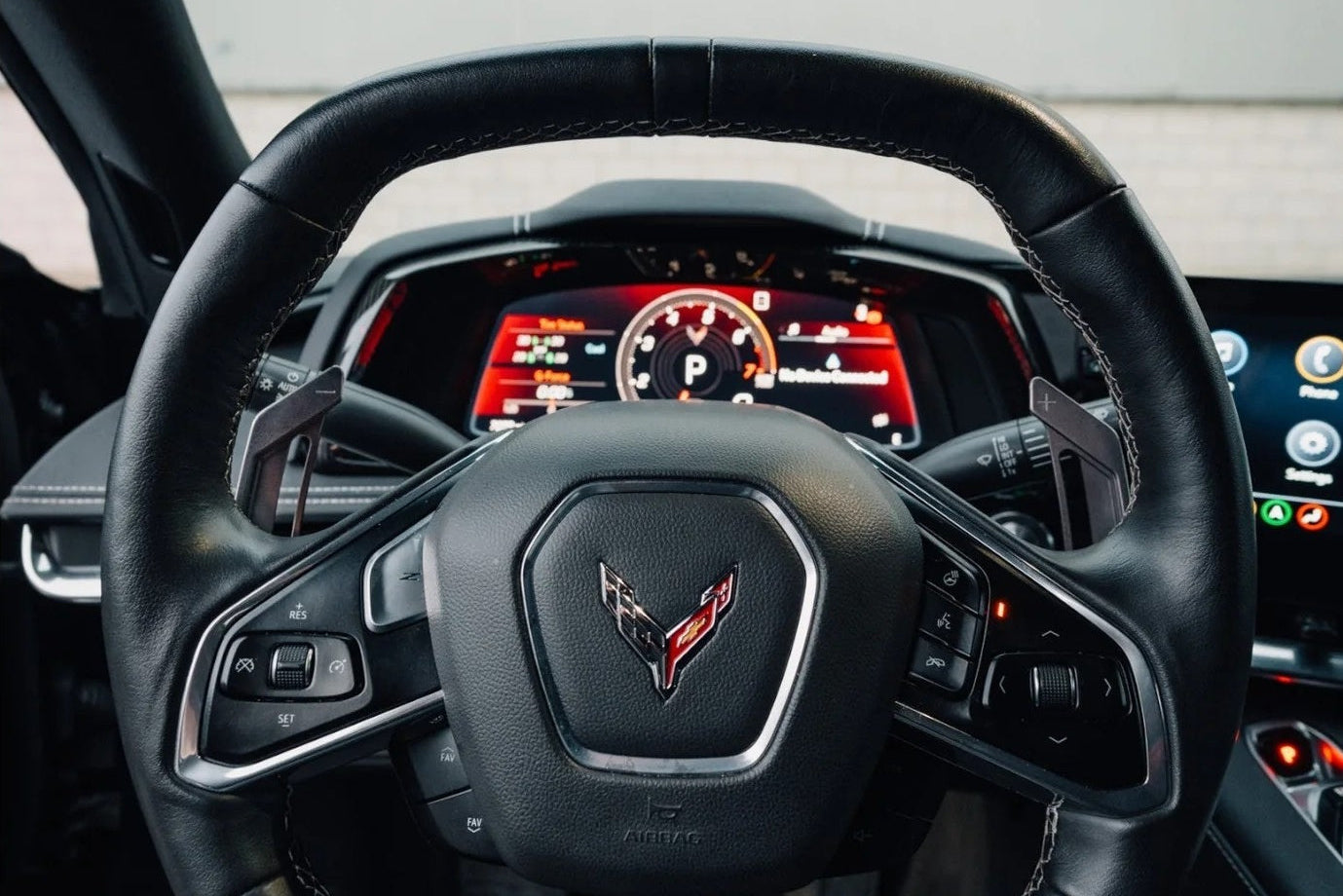 MAED C8 Corvette magnetic billet shift paddles installed inside the interior of the vehicle.