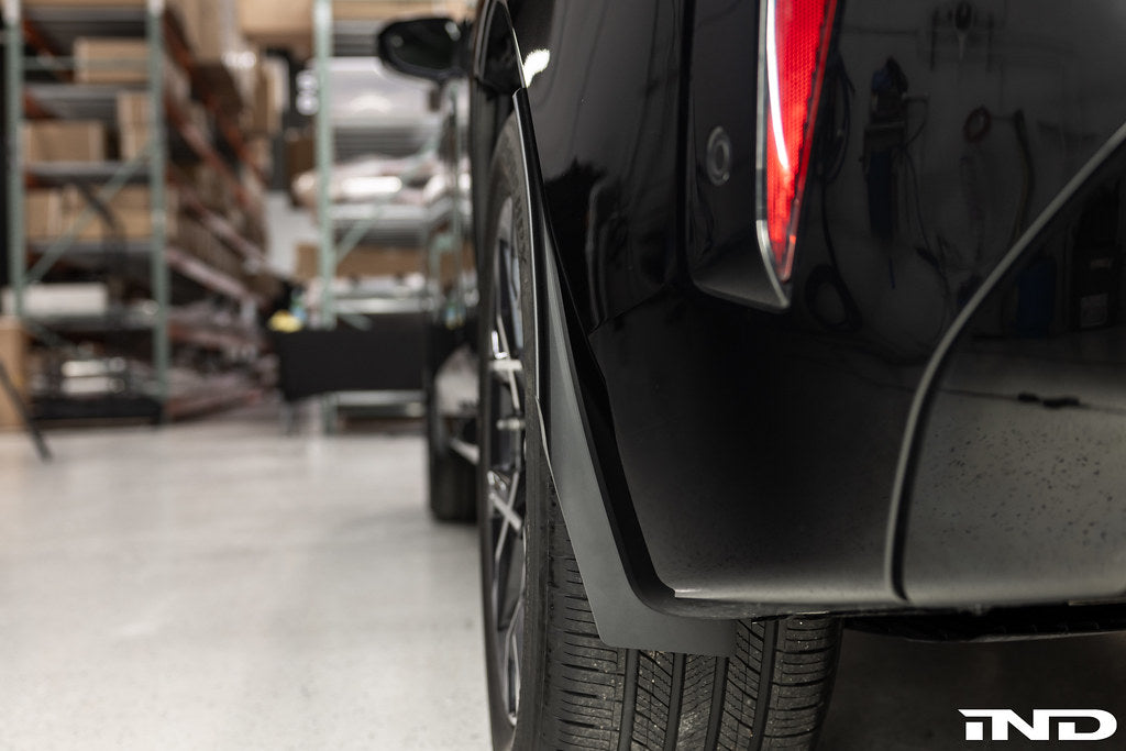 Megachip G45 X3 splash guard set installed on a BMW G45 X3 exterior, factory bodyline fitment in natural black finish.