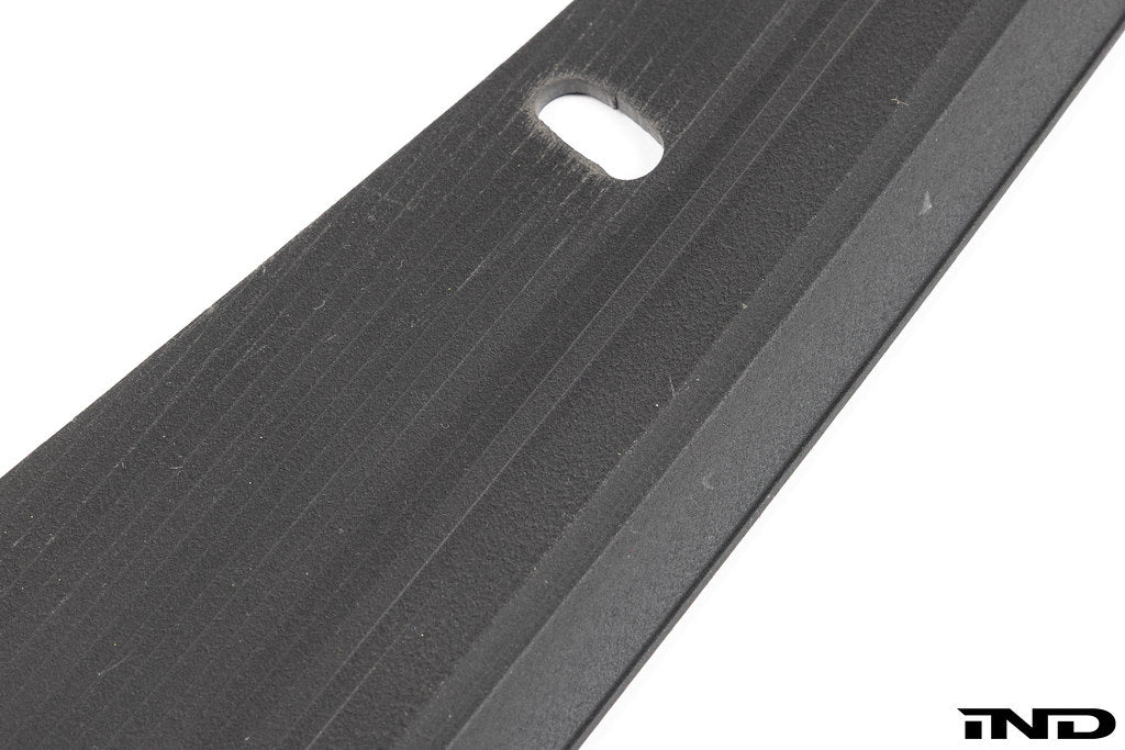 Megachip MK8 GTI and Golf R splash guard set installed on car with white background, showing durable exterior protection.