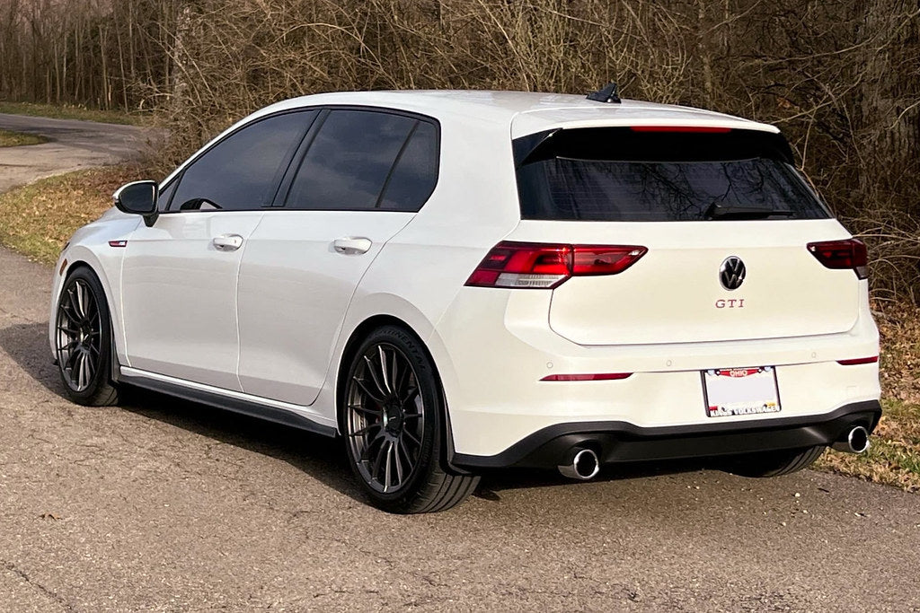 Megachip MK8 GTI and Golf R splash guard set installed on front of vehicle, showing exterior protection for wheel arches.