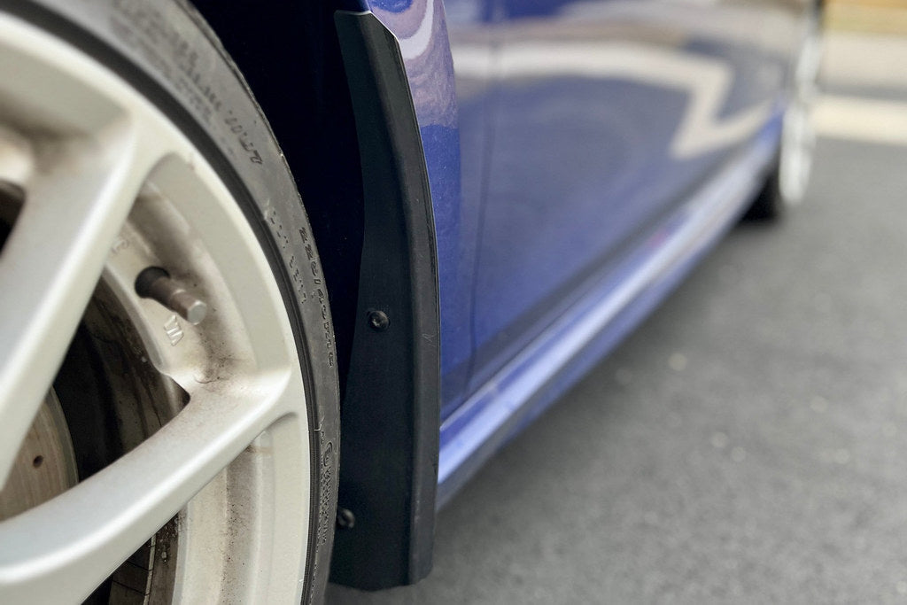 Front angle of Megachip MK8 GTI and Golf R splash guard set installed on the exterior of the vehicle.