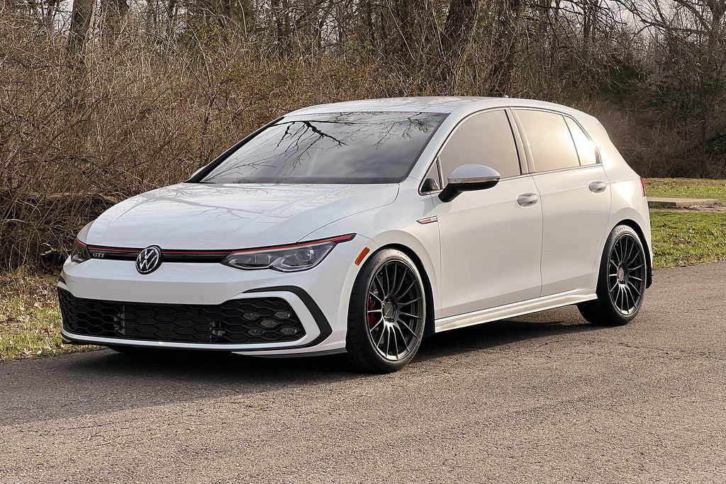 Front view of Megachip MK8 GTI Golf R splash guards installed on the vehicle's exterior, protecting wheel arches from debris.