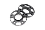 Black anodized MMX Performance BMW / Supra 5x112 wheel spacer kit with 12mm, 15mm, and 18mm spacers for enhanced fitment.