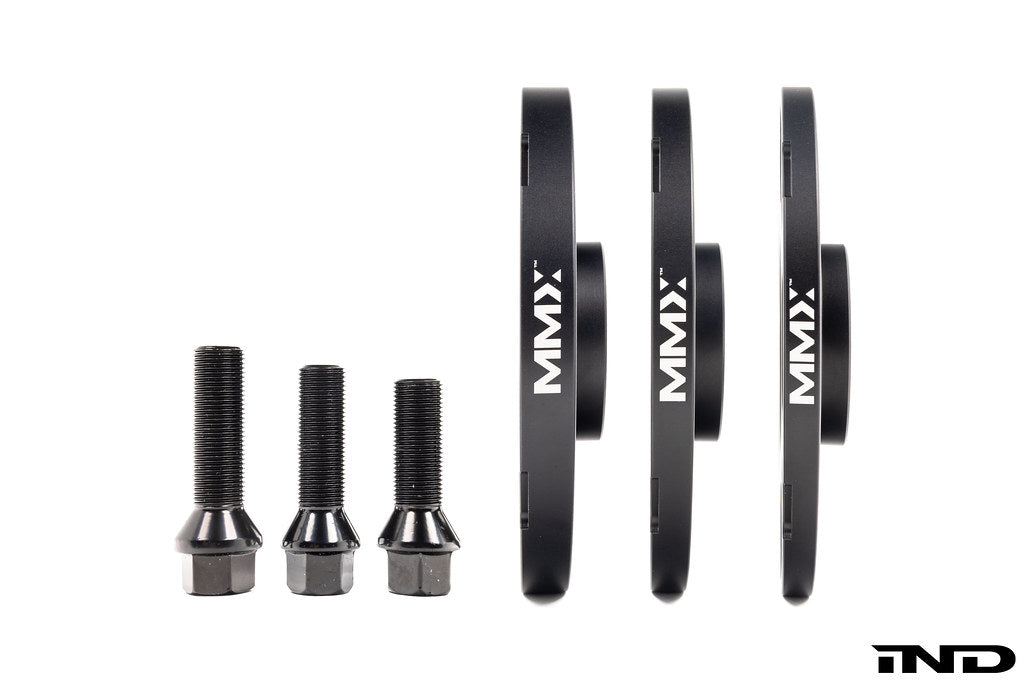 MMX Performance BMW / Supra 5x112 wheel spacer kit in black anodized finish, includes 12mm, 15mm, and 18mm spacers on wheels.