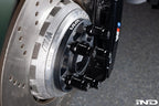 MMX Performance BMW / Supra 5x112 wheel spacer kit installed on G80, G82, G87 with wheels and suspension visible.
