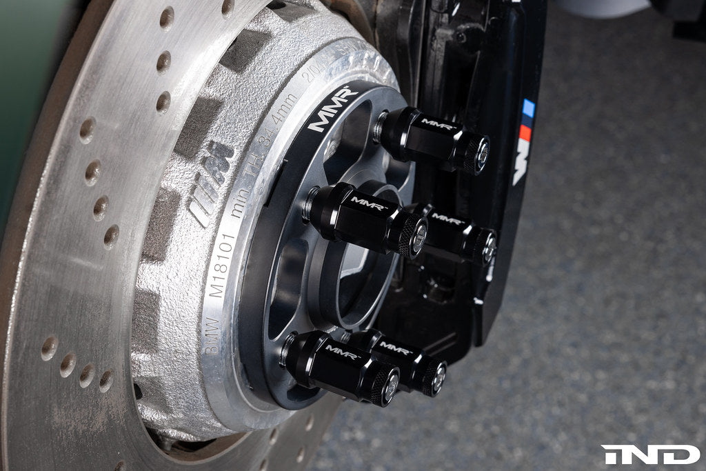 MMX Performance BMW and Supra 5x112 wheel spacer kit installed on G80, G82, and G87 models showing fitment and wheel details.