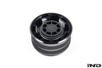 Black anodized MMX Performance BMW billet coolant expansion cap with 60mm diameter on white background.