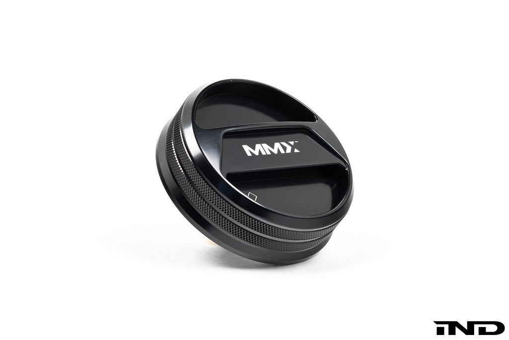 Black anodized MMX Performance BMW billet coolant expansion cap, 90mm, with white background, designed for high-performance cooling systems.