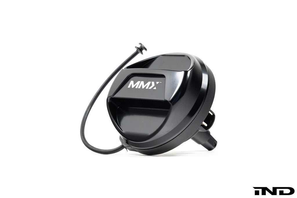 Black anodized MMX Performance billet fuel cap for BMW, exterior view showing sleek, durable design on a white background.