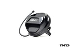 Black anodized MMX Performance billet fuel cap for BMW, exterior view showing sleek, durable design on a white background.