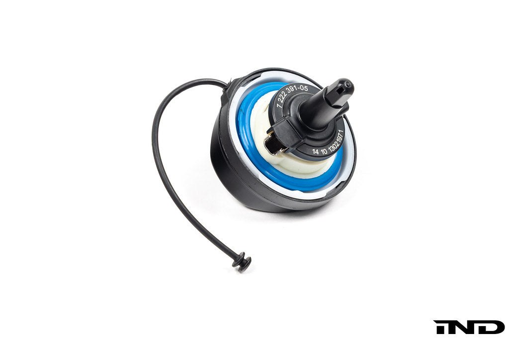 Black anodized MMX Performance billet fuel cap for BMW, exterior view showing sleek metal finish against a white background.