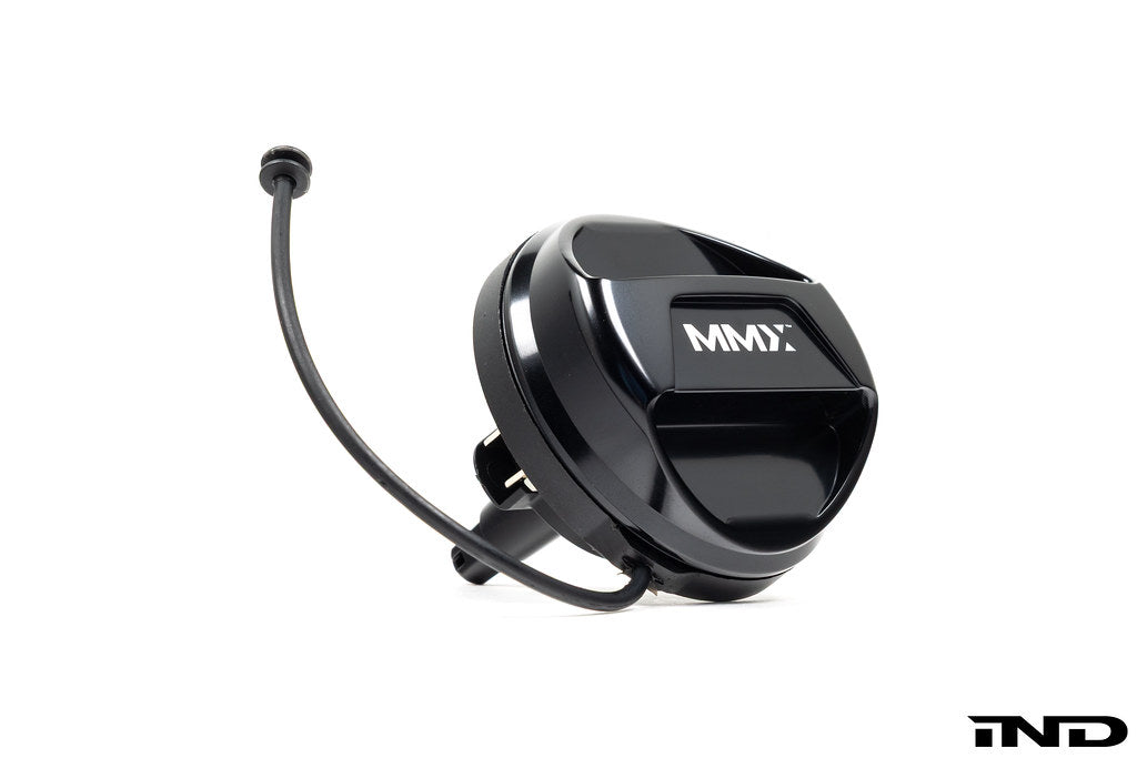 Black anodized MMX Performance billet fuel cap for BMW, exterior view showing sleek, durable design on a white background.