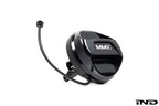 Black anodized MMX Performance billet fuel cap for BMW, exterior view showing sleek, durable design on a white background.