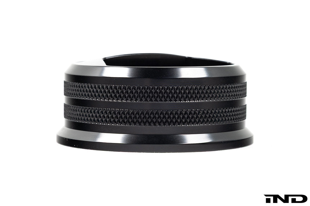 MMX Performance black anodized billet oil filler cap for BMW engines, showcasing a sleek, durable design on a white background.