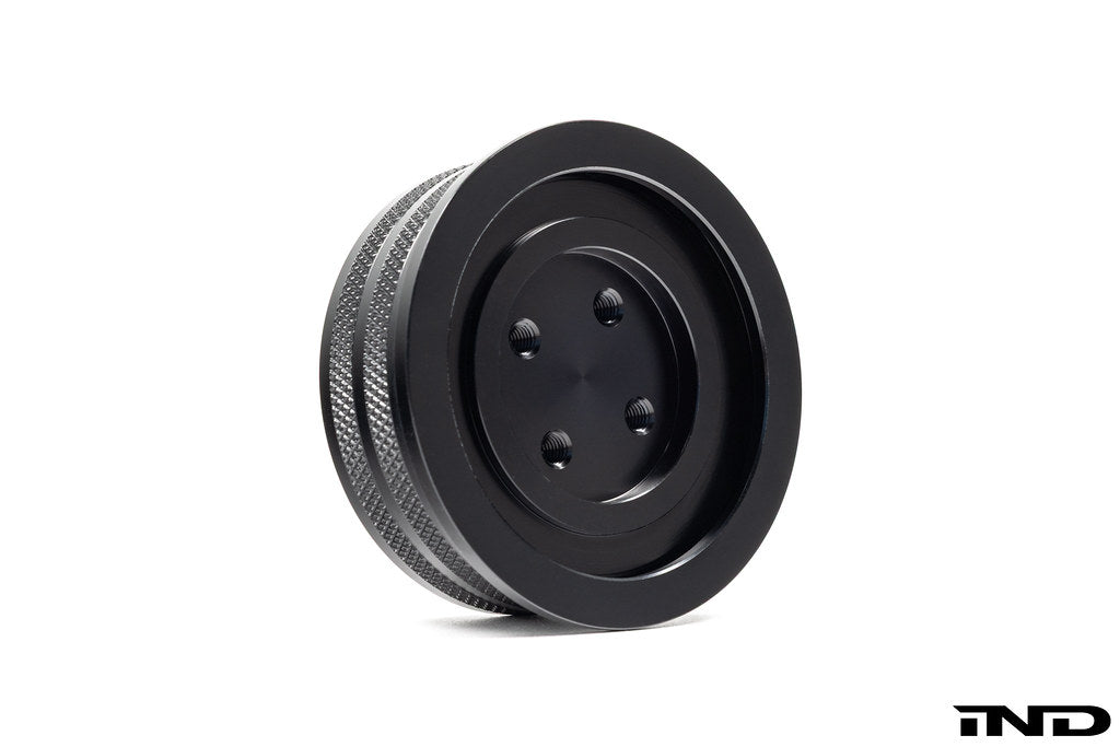 Black anodized MMX Performance BMW billet oil filler cap with precision machining, designed for enhanced engine performance.