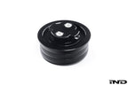 Black anodized MMX Performance BMW billet oil filler cap with sleek design, designed for BMW engine oil fill ports.