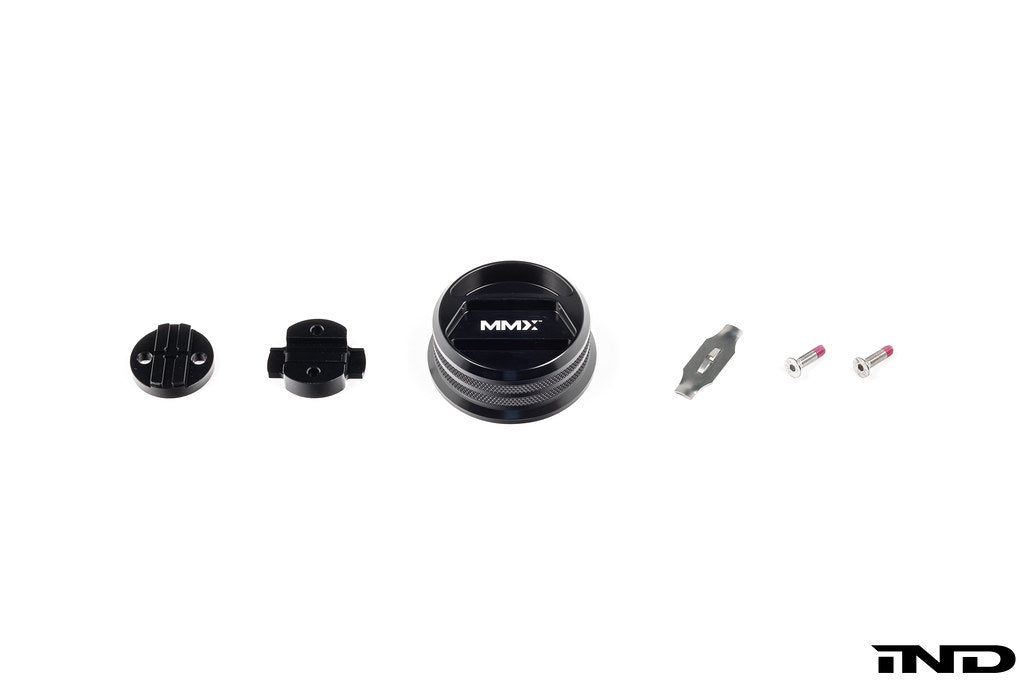 Black anodized MMX Performance BMW billet oil filler cap shown on a white background, designed for high-performance engine applications.
