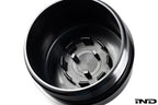 MMX Performance BMW N20/N55/S55 billet oil filter housing cap in black anodized finish, exterior view on white background.