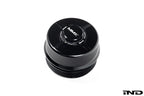 MMX Performance black anodized billet oil filter housing cap for BMW N20, N55, S55 engines, shown on white background.