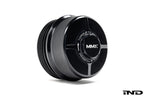 Black anodized MMX Performance billet oil filter housing cap for BMW N20, N55, and S55 engines, exterior view on white background.