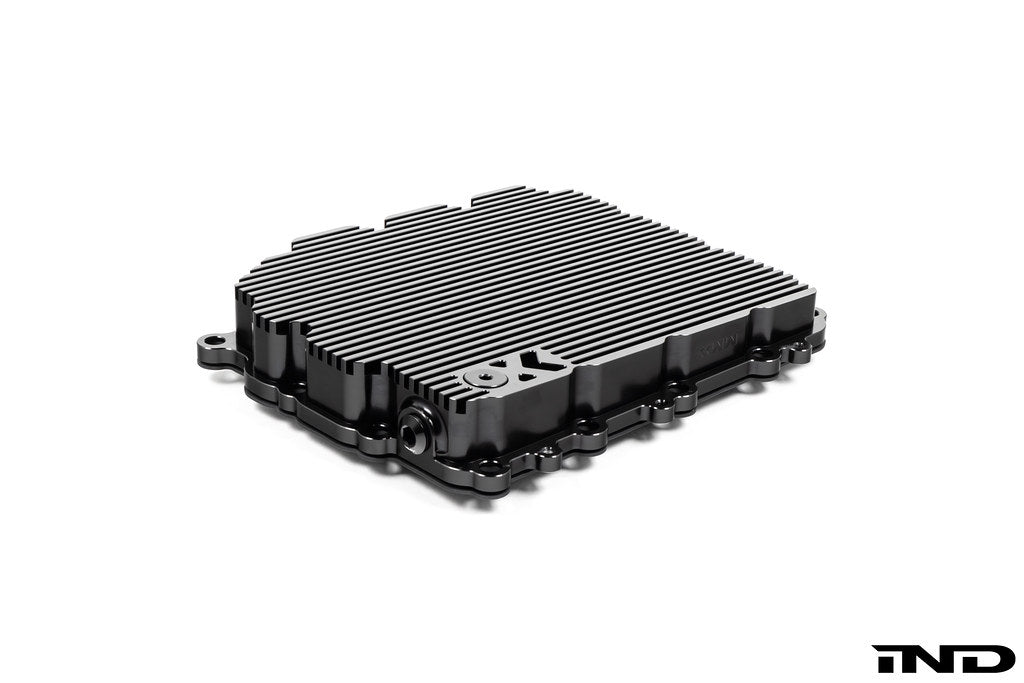 Black anodized aluminum BMW DCT oil pan by MMX Performance, designed for high-performance transmission oil containment.