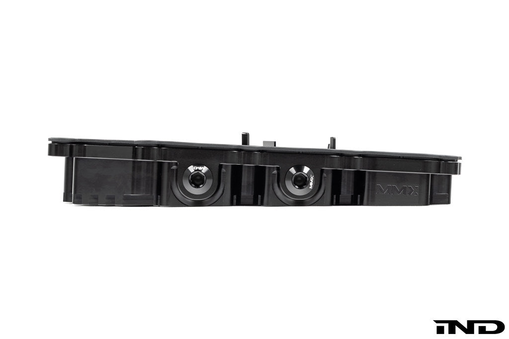 Black anodized billet aluminum BMW DCT oil pan by MMX Performance, designed for high-performance transmission cooling.
