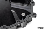 Black anodized aluminum BMW DCT oil pan by MMX Performance, designed for high-performance transmission cooling.