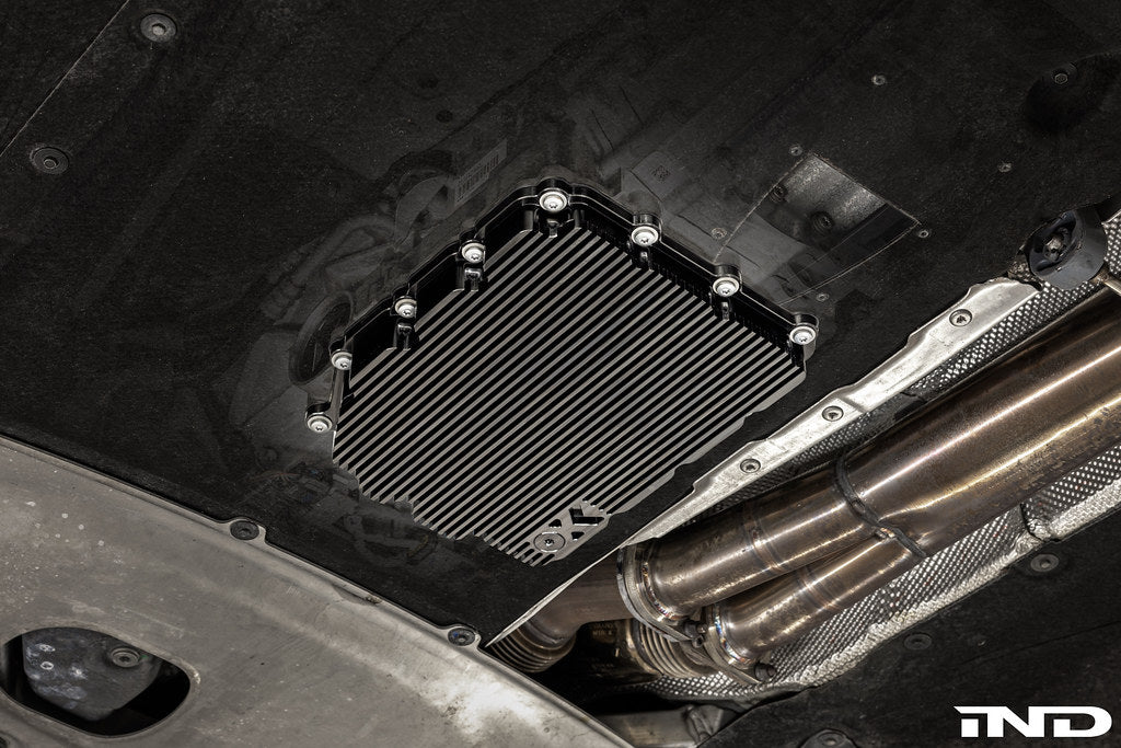 Black anodized MMX Performance aluminum BMW DCT oil pan installed, designed for high performance and durability.