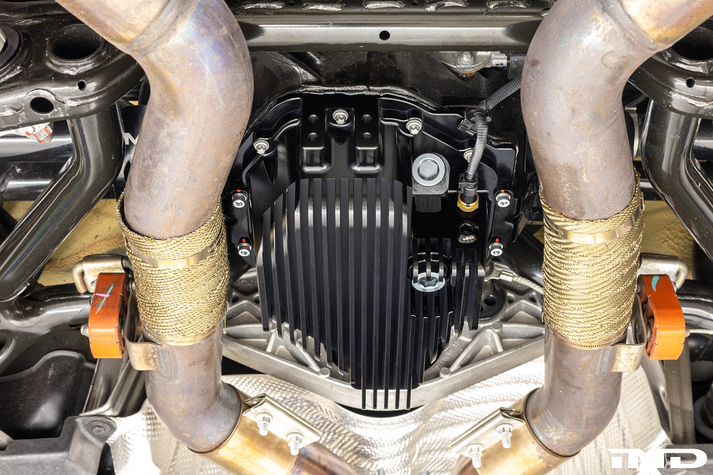 MMX high capacity baffled differential sump installed on BMW G8X rear axle for track use