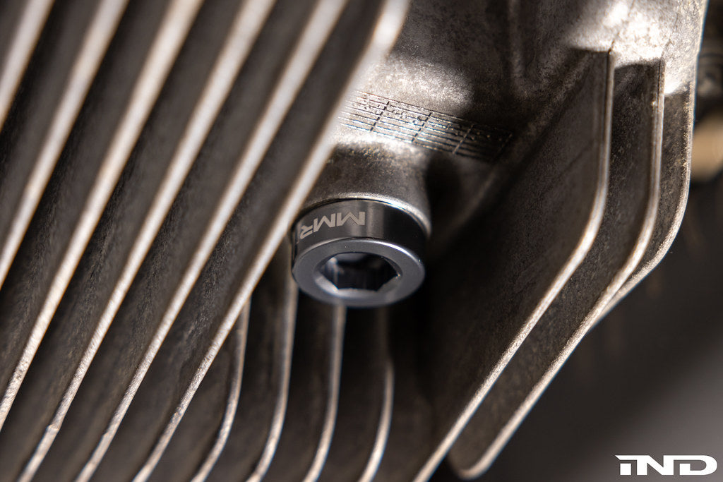 MMX Performance magnetic differential oil drain plug installed on a vehicle, M22x1.5 size, designed for BMW and performance applications