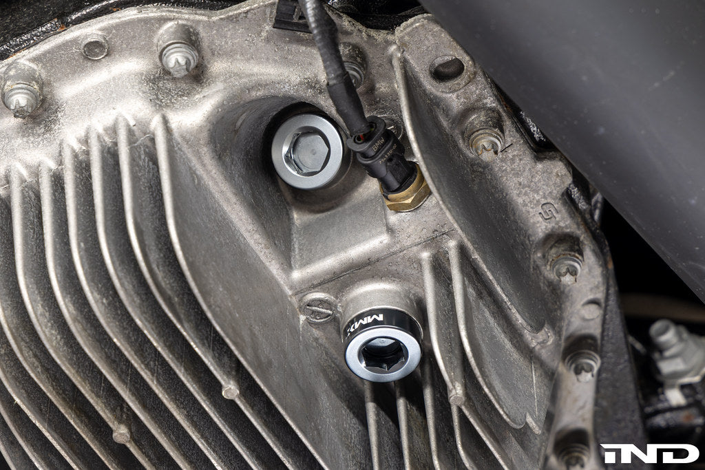 MMX Performance magnetic differential oil drain plug for BMW, M22x1.5 size, installed on vehicle's differential.
