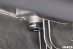 MMX Performance magnetic differential oil drain plug installed on a vehicle, M22x1.5 size, for improved fluid management and protection.