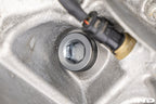 MMX Performance magnetic differential oil drain plug installed on a vehicle, M22x1.5 size, for enhanced performance and protection