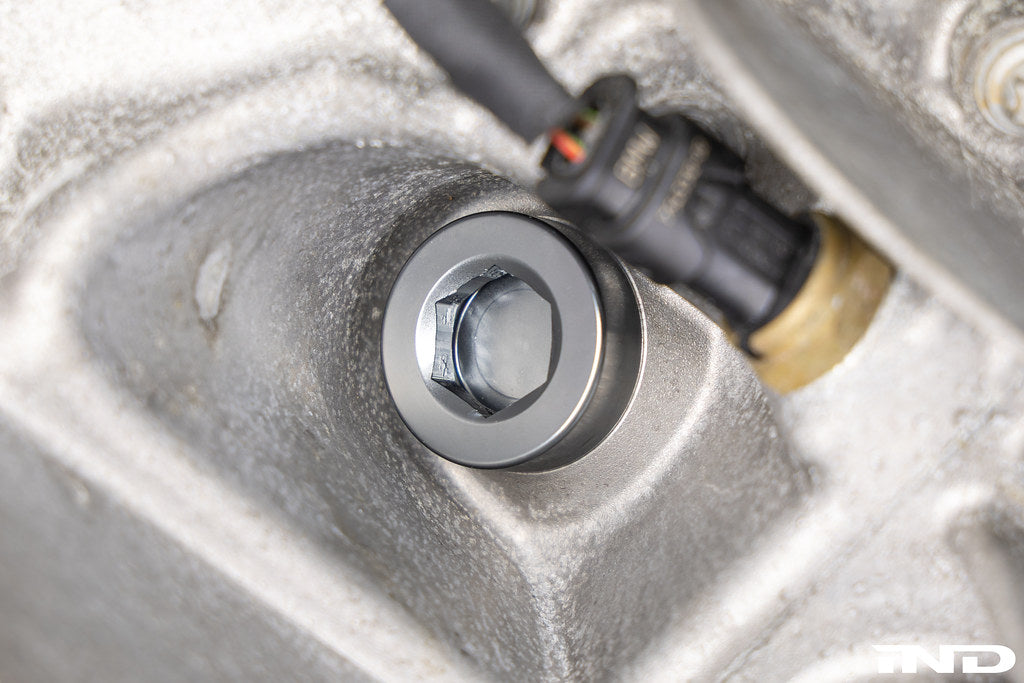 MMX Performance magnetic differential oil drain plug installed on a vehicle, M22x1.5 size, for enhanced performance and protection