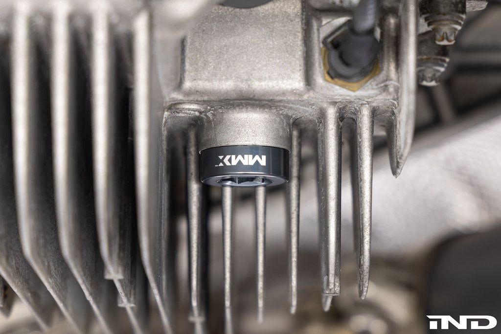 MMX Performance magnetic differential oil drain plug for BMW, M22x1.5 size, installed on vehicle for improved oil management.