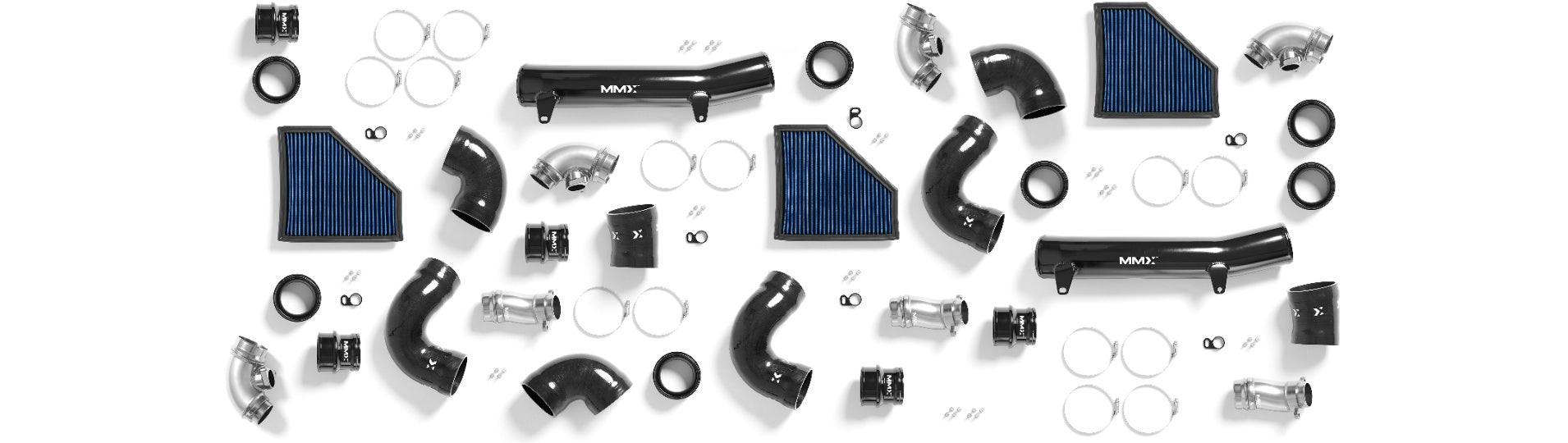 MMX Performance G8X M2 M3 M4 Ultimate Intake Solution components laid out on a white background featuring aluminum intake pipes, turbo inlet elbows, silicone couplers, and washable cotton air filters for the BMW S58 engine.
