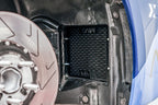 MMX Performance G8X M2/M3/M4 front wheel arch clearance kit installed on car with fitted fender liner.