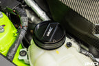 MMX Performance BMW billet coolant expansion cap installed, showcasing a sleek, high-performance engine upgrade accessory.