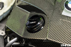 BMW engine with MMX Performance billet oil filler cap installed, showcasing a sleek, durable aluminum cap on the engine.