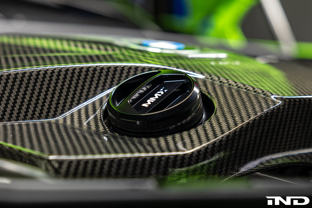 MMX Performance BMW billet oil filler cap installed on engine, showcasing sleek metal design and precise fit for performance vehicles.